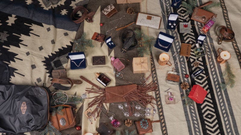 a collection of stocking stuffer gift items on wood table